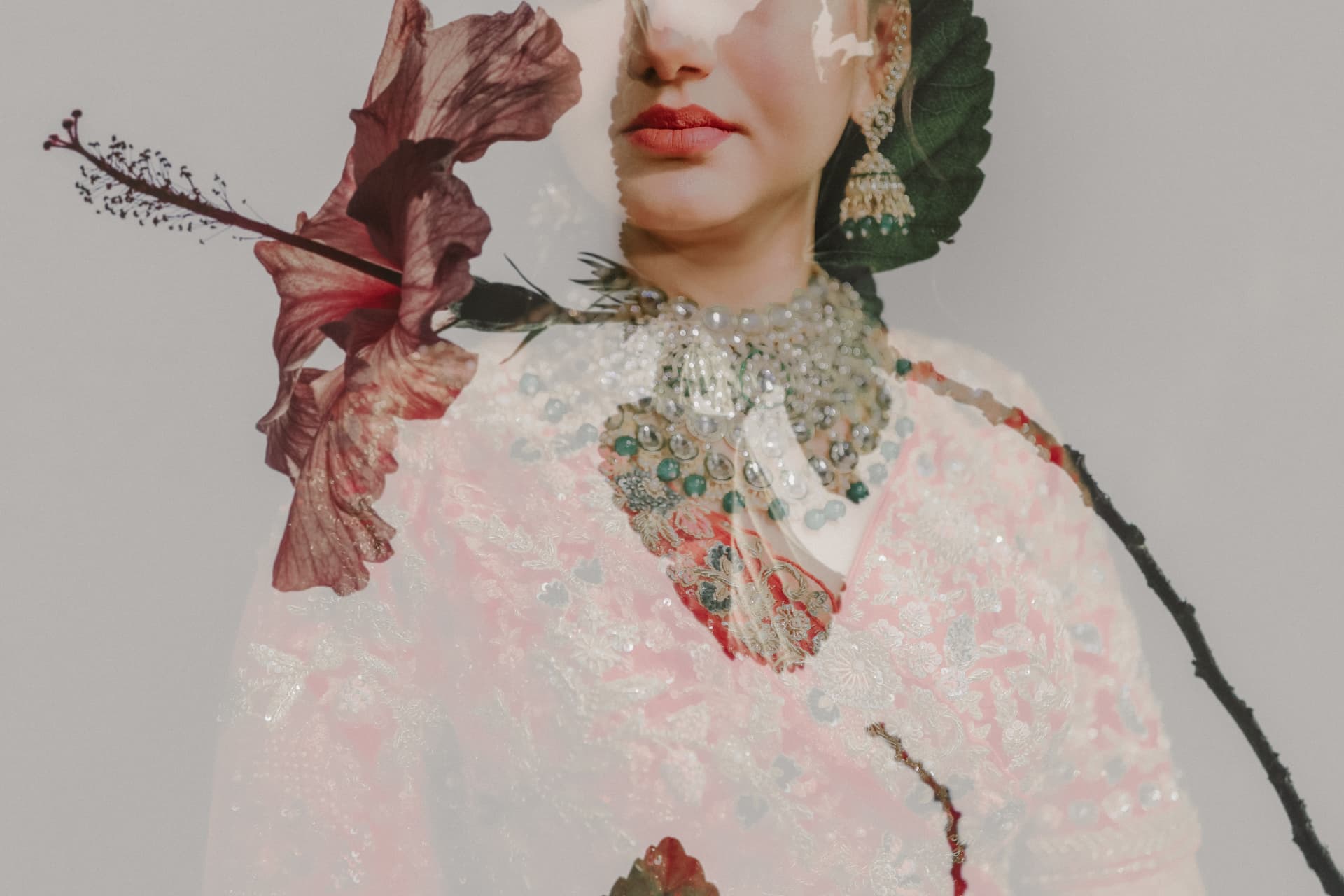 Double-exposure portrait of Soumya in bridal kundan jewellery layered with a hibiscus bloom