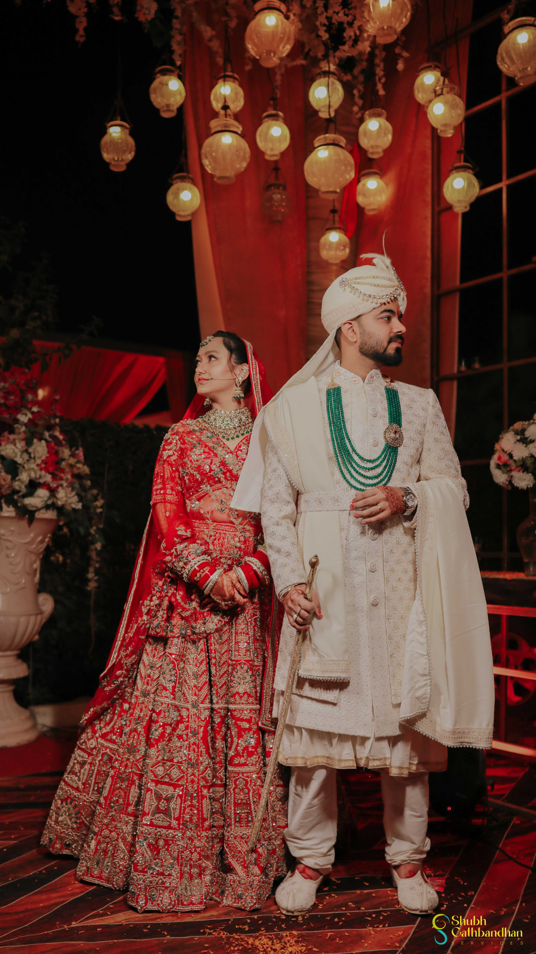 Anand and Soumya together beneath the lantern-lit mandap on their wedding day