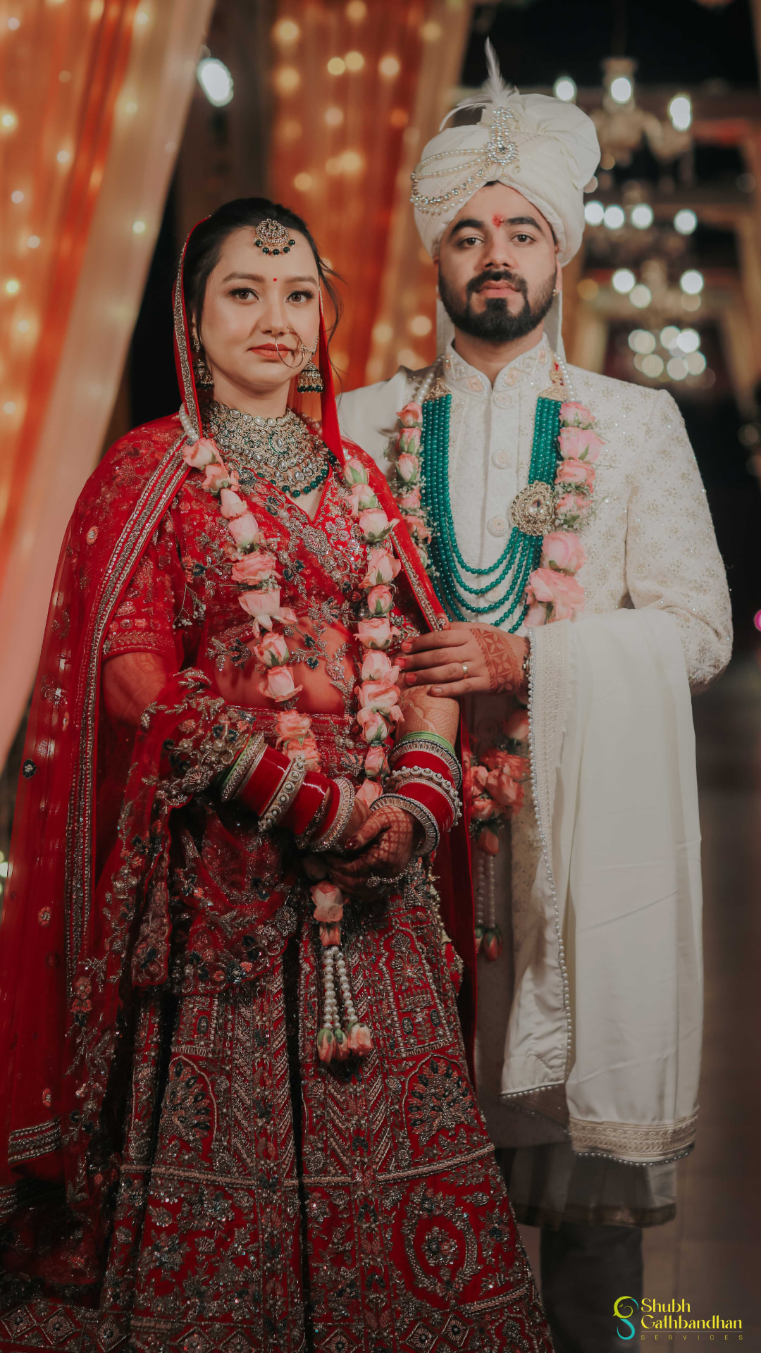 Anand and Soumya in their rose varmala garlands after the exchange
